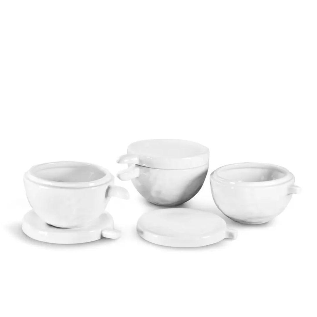 Set of 3 white handmade ceramic bowls by Montes Doggett, with lids and handles.