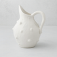 Handmade creamy white ceramic bumpy pitcher by Montes Doggett, 6.5"Dia x 11"H.