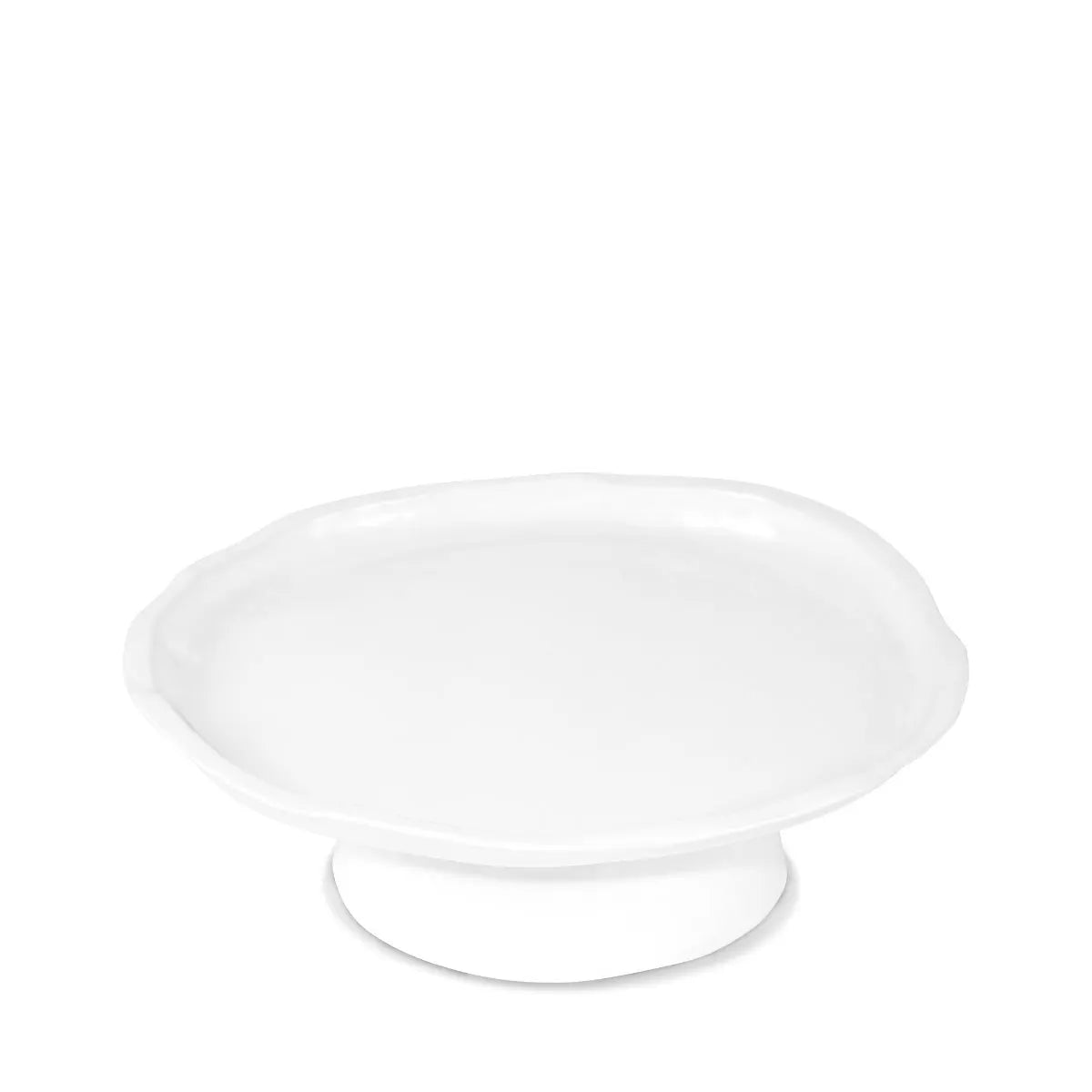 Small handmade creamy white ceramic cake stand with organic wavy edges.