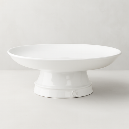 Handmade creamy white ceramic catchall pedestal bowl, 12.5"D, by Montes Doggett.