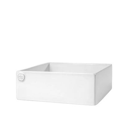 Handmade creamy white ceramic cocktail napkin holder by Montes Doggett, 5.5" square, with "MD" emblem.