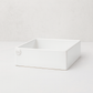 Handmade creamy white ceramic cocktail napkin holder with "MD" embossed logo.