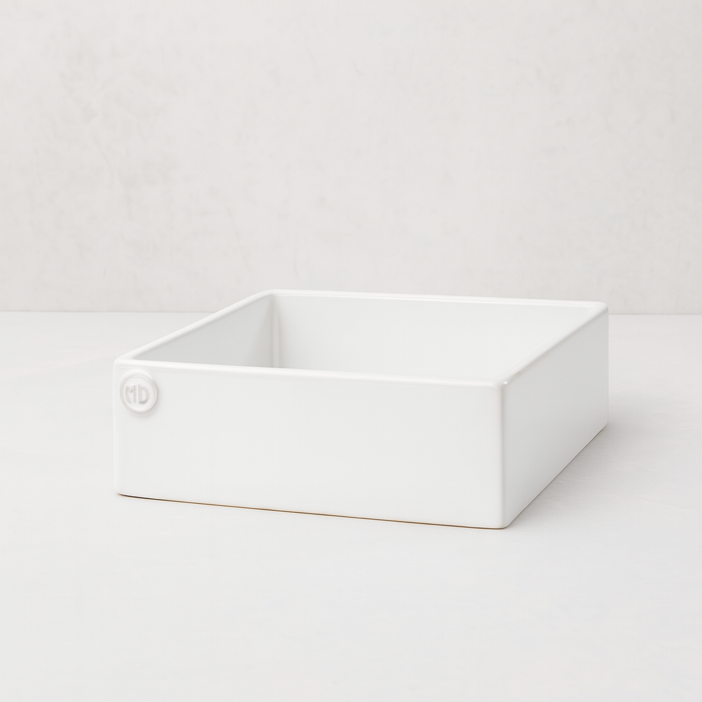 Handmade creamy white ceramic cocktail napkin holder with "MD" embossed logo.