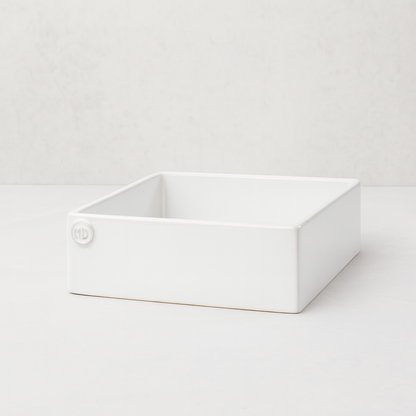 Handmade creamy white ceramic cocktail napkin holder with "MD" embossed logo.