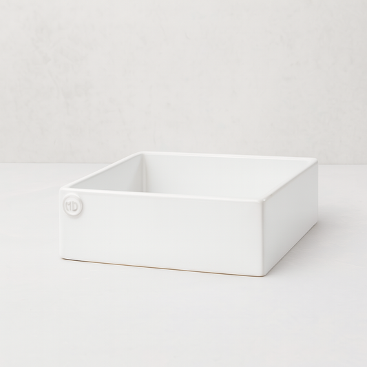 Handmade creamy white ceramic cocktail napkin holder with "MD" embossed logo.