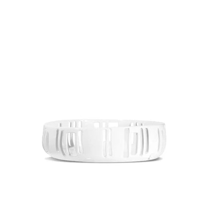 Creamy white ceramic colander by Montes Doggett, 12"Dia x 3.5"H, with vertical cutouts.