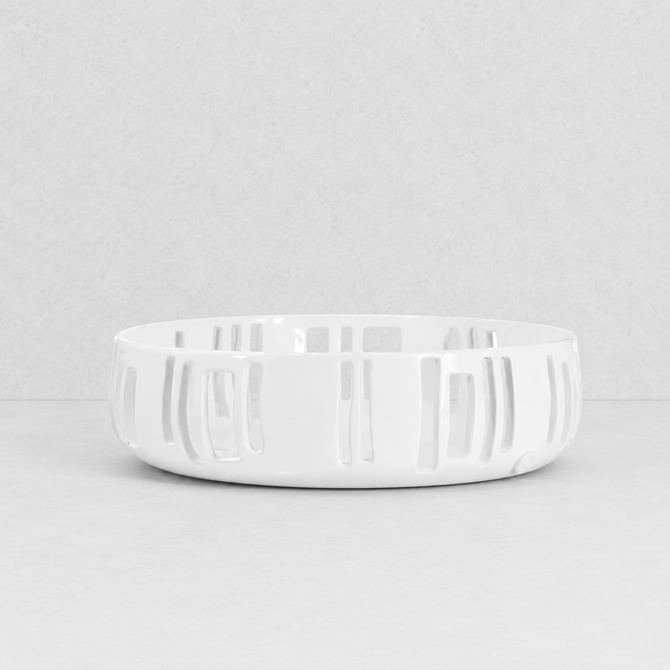 Handmade creamy white ceramic colander by Montes Doggett, 12"Dia x 3.5"H, with vertical slotted design.