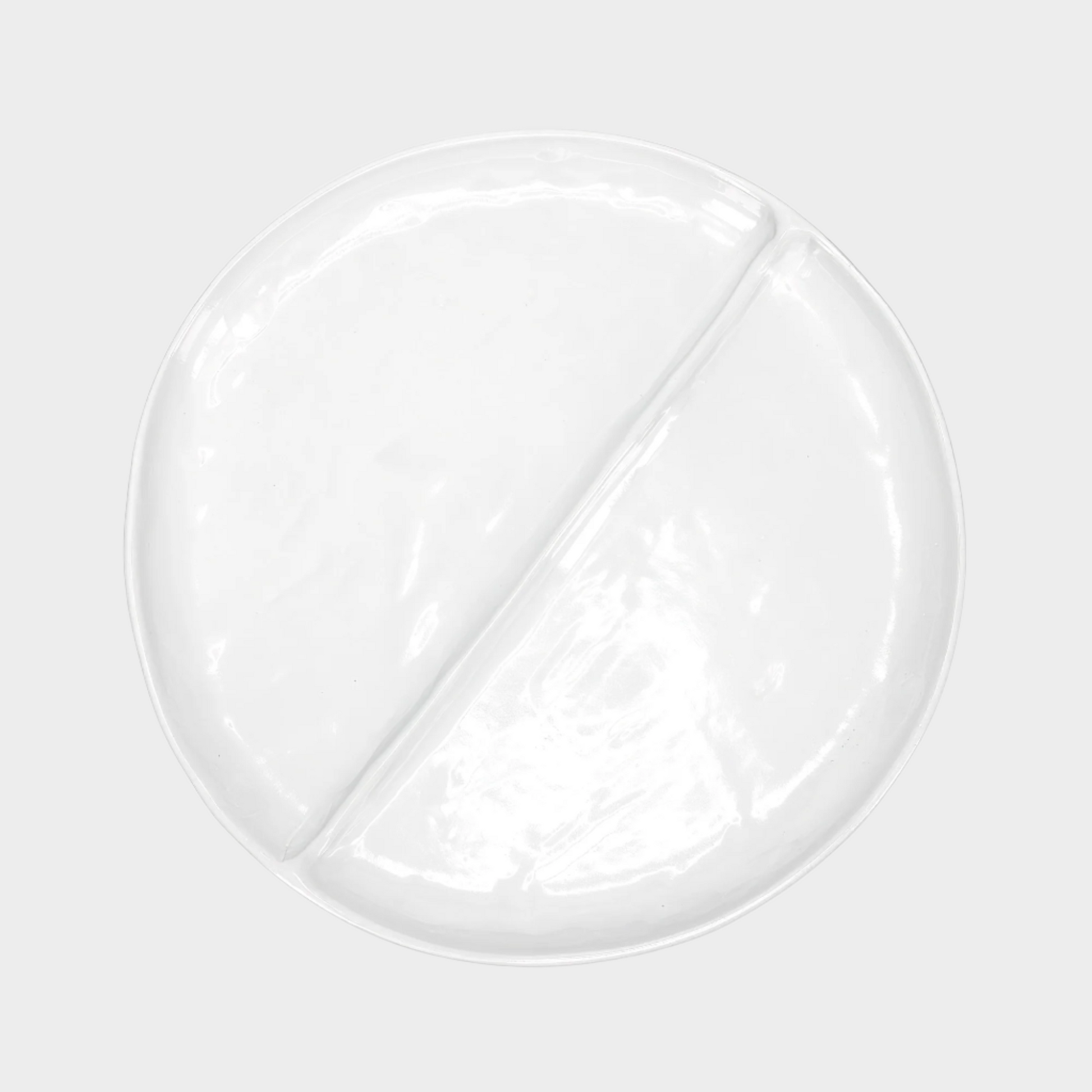 Handmade Montes Doggett creamy white ceramic 15" divided plate with two sections.