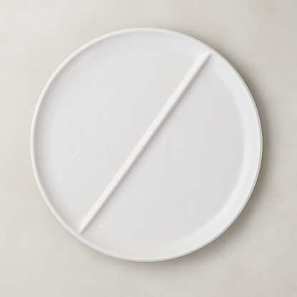 Handmade Montes Doggett creamy white ceramic 15" divided plate with two sections.