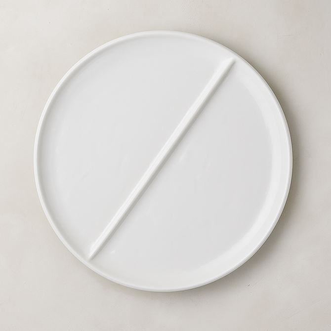 Handmade Montes Doggett creamy white ceramic 15" divided plate with two sections.
