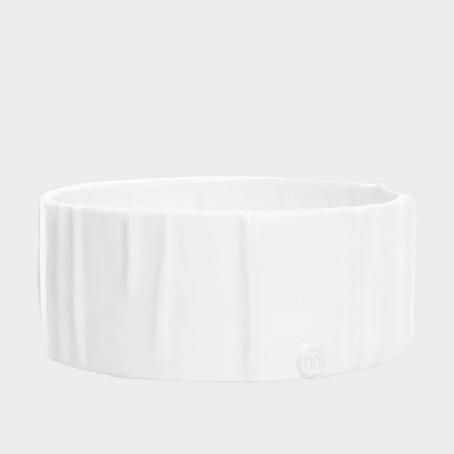Handmade creamy white ceramic dog bowl by Montes Doggett, 8"Dia x 3"H, with textured sides.