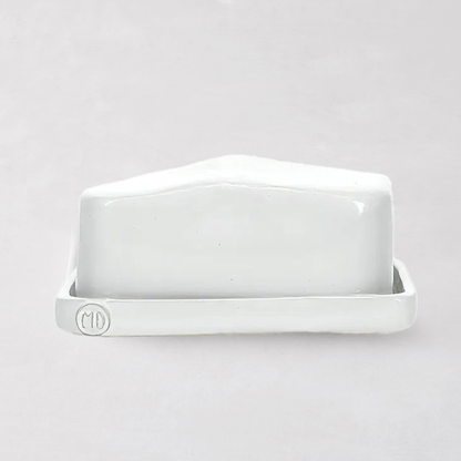 Handmade creamy white ceramic European butter dish by Montes Doggett, with "MD" logo.