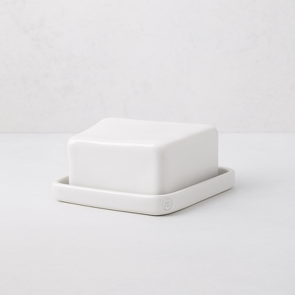 Handmade creamy white ceramic European butter dish by Montes Doggett, 6"L x 4.5"W x 3"H.