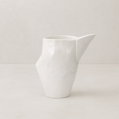 Handmade creamy white ceramic pitcher by Montes Doggett, 9.5"L x 6.5"W x 10"H.