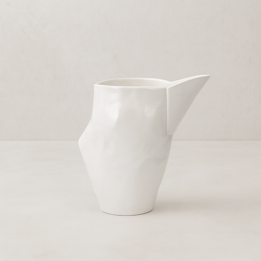 Handmade creamy white ceramic pitcher by Montes Doggett, 9.5"L x 6.5"W x 10"H.