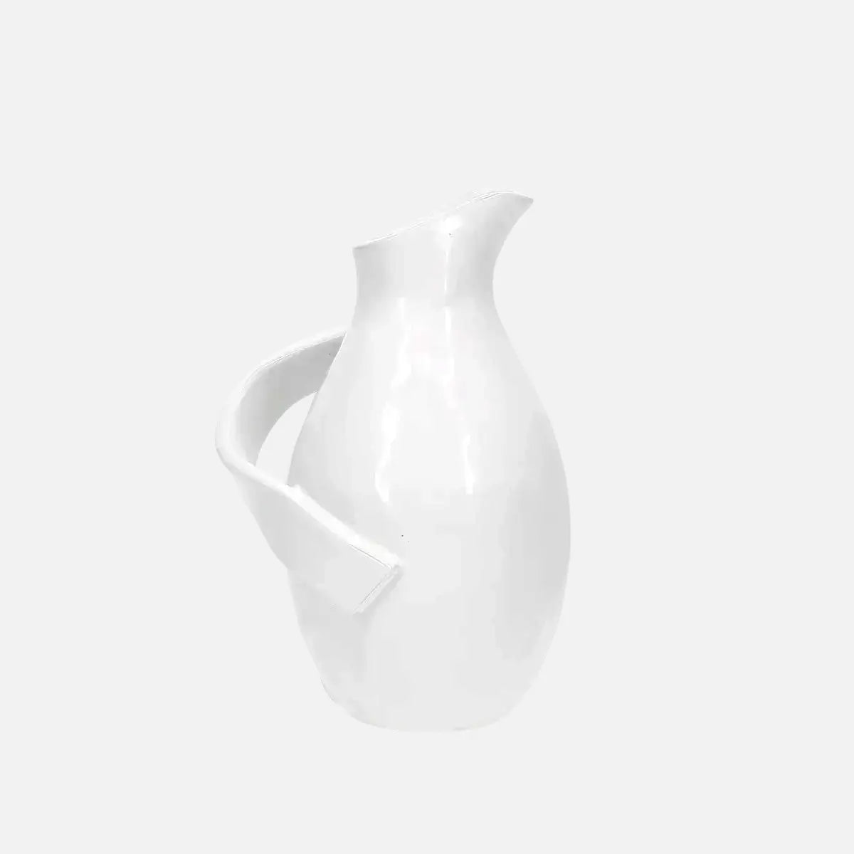 montes doggett 4652 handmade white ceramic pitcher with a smooth glaze and unique side handle design.