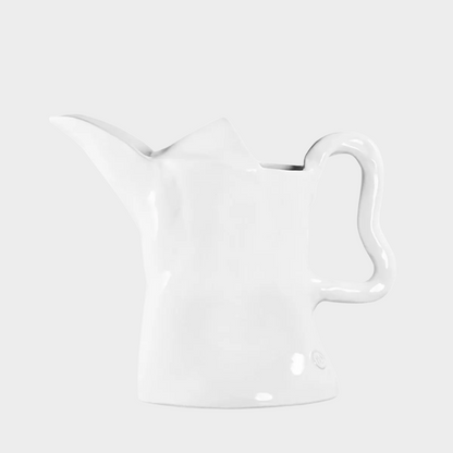Handmade creamy white ceramic pitcher by Montes Doggett, organic shape, 9"H.