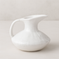 Handmade creamy white ceramic pitcher 5431 by Montes Doggett, organic shape, 11"D x 10"H.