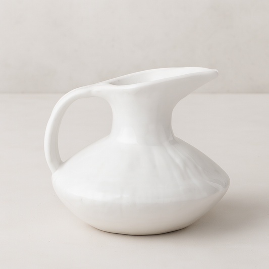 Handmade creamy white ceramic pitcher 5431 by Montes Doggett, organic shape, 11"D x 10"H.