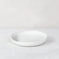 White handmade ceramic platter 5316-S by Montes Doggett, round with organic shape and raised edge.