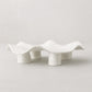 Handmade creamy white ceramic platter 5450 by Montes Doggett, organic wavy shape on four legs.