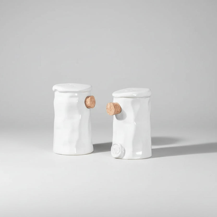 Handmade creamy white ceramic salt and pepper shakers with cork stoppers, Montes Doggett collection.