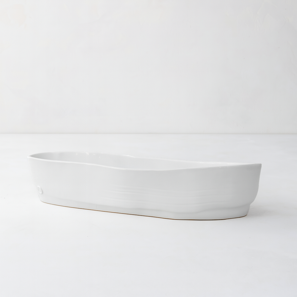 Handmade creamy white ceramic oval serve bowl by Montes Doggett, 15.5"L.