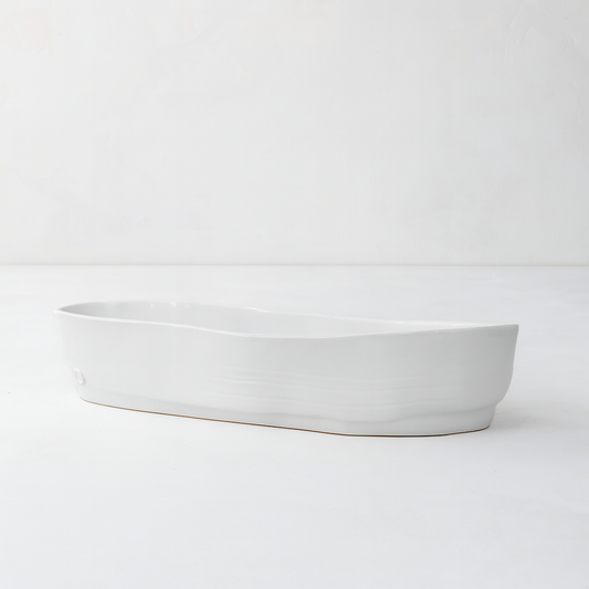 Handmade creamy white ceramic oval serve bowl by Montes Doggett, 15.5"L.