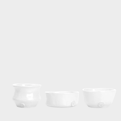 Set of 3 Montes Doggett handmade creamy white ceramic serve bowls, organic shapes.