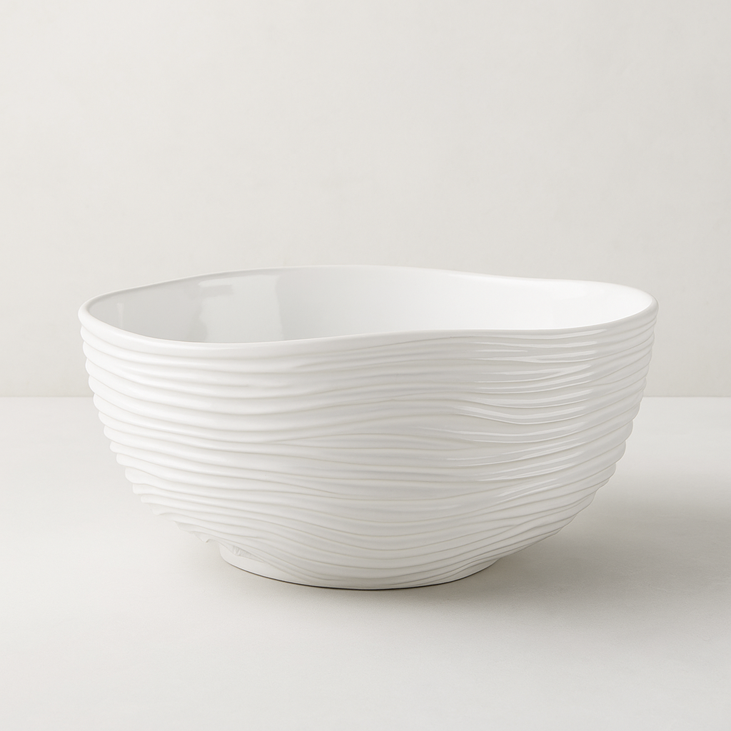 Handmade creamy white ceramic serve bowl by Montes Doggett with desert-inspired ripple texture.