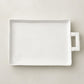 Handmade Montes Doggett Ceramic Platter 5454, creamy white, oversized, organic shape, with handle and "1205" stamp.