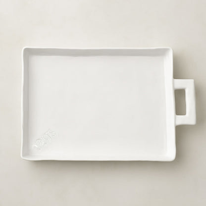 Handmade Montes Doggett Ceramic Platter 5454, creamy white, oversized, organic shape, with handle and "1205" stamp.