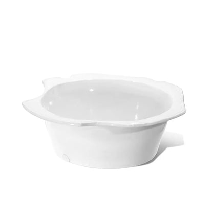 Handmade creamy white ceramic small bowl by Montes Doggett, 12"Dia x 4.5"H, with a wavy rim.