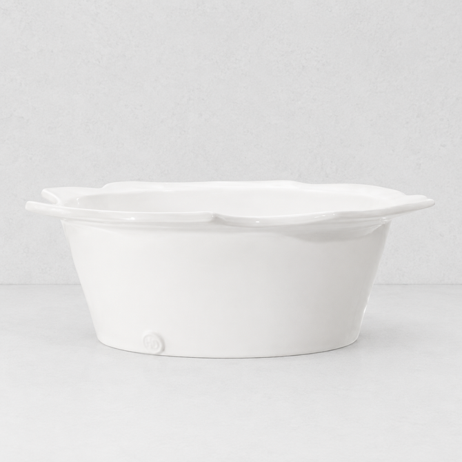 Handmade Montes Doggett ceramic small bowl, creamy white glaze, scalloped rim, 12"Dia x 4.5"H.