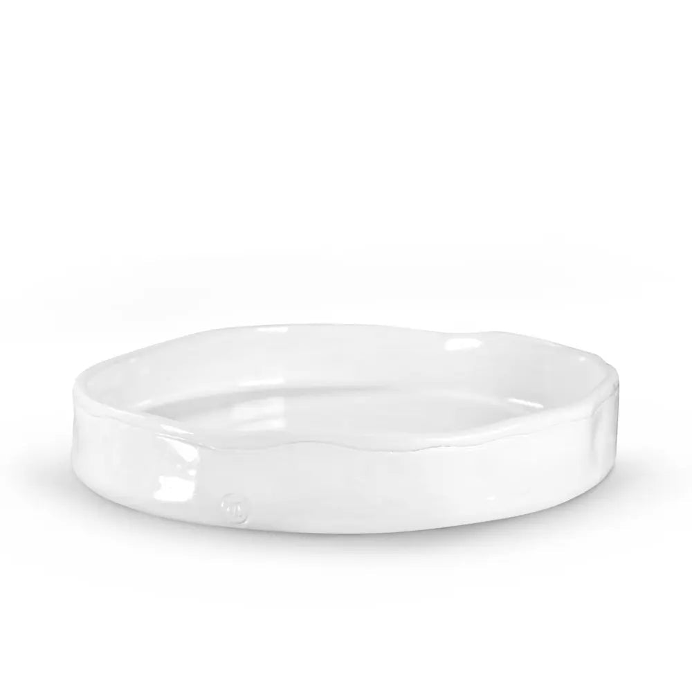 Handmade Montes Doggett ceramic tray, creamy white glaze, 11" round, wavy rim.