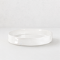 Handmade Montes Doggett ceramic tray, creamy white glaze, 11" round, wavy rim.