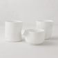 Set of 3 handmade Montes Doggett creamy white ceramic tumblers, various sizes, unique designs.
