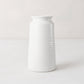 Handmade white ceramic vase 4818 by Montes Doggett, 14"H, with curved edge and horizontal ridges.