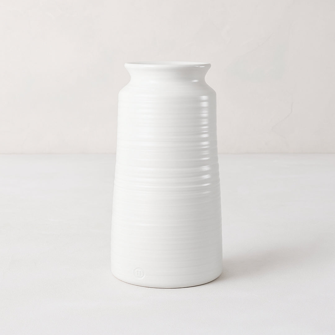 Handmade white ceramic vase 4818 by Montes Doggett, 14"H, with curved edge and horizontal ridges.