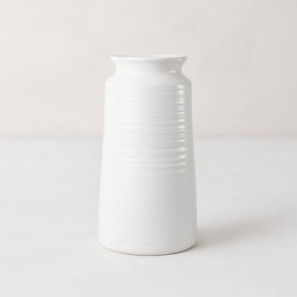 Handmade white ceramic vase 4818 by Montes Doggett, 14"H, with curved edge and horizontal ridges.