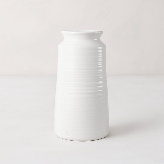 Handmade white ceramic vase 4818 by Montes Doggett, 14"H, with curved edge and horizontal ridges.