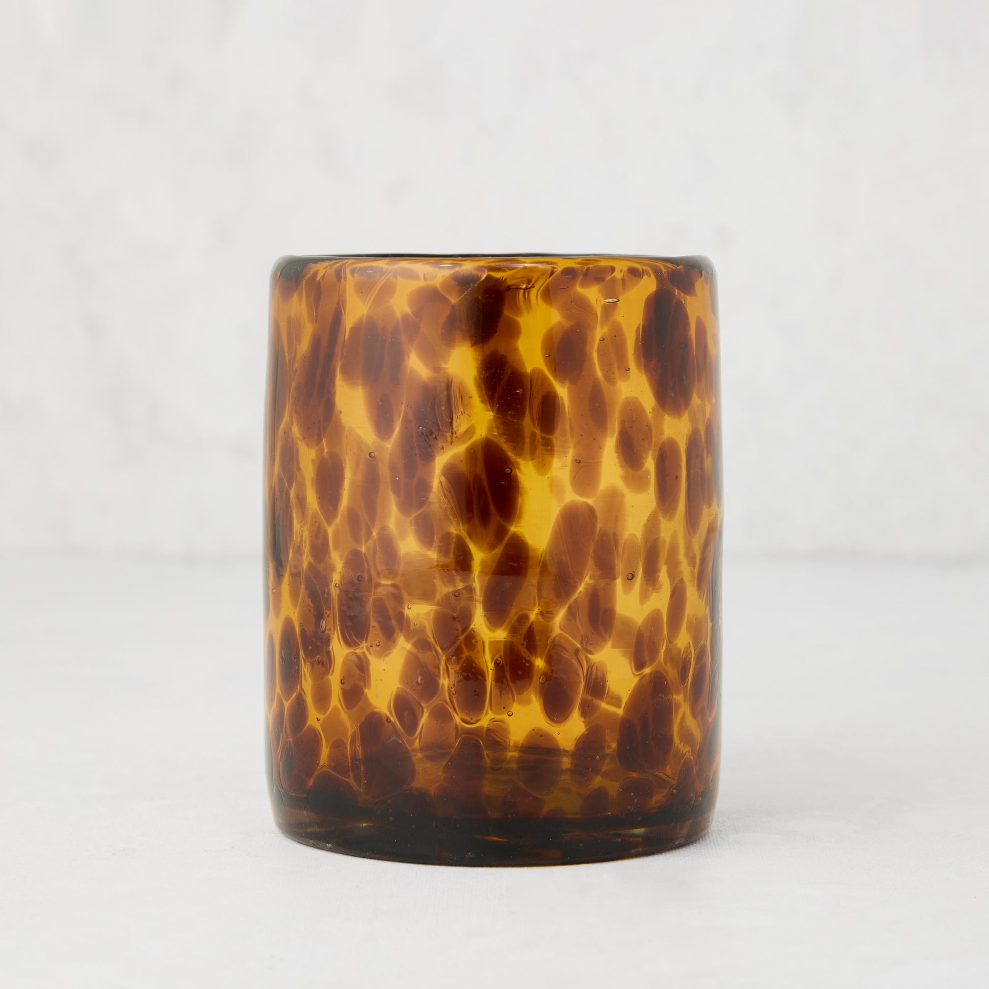Handmade 12 oz. mouth-blown amber and brown tortoise pattern double old-fashioned glass.