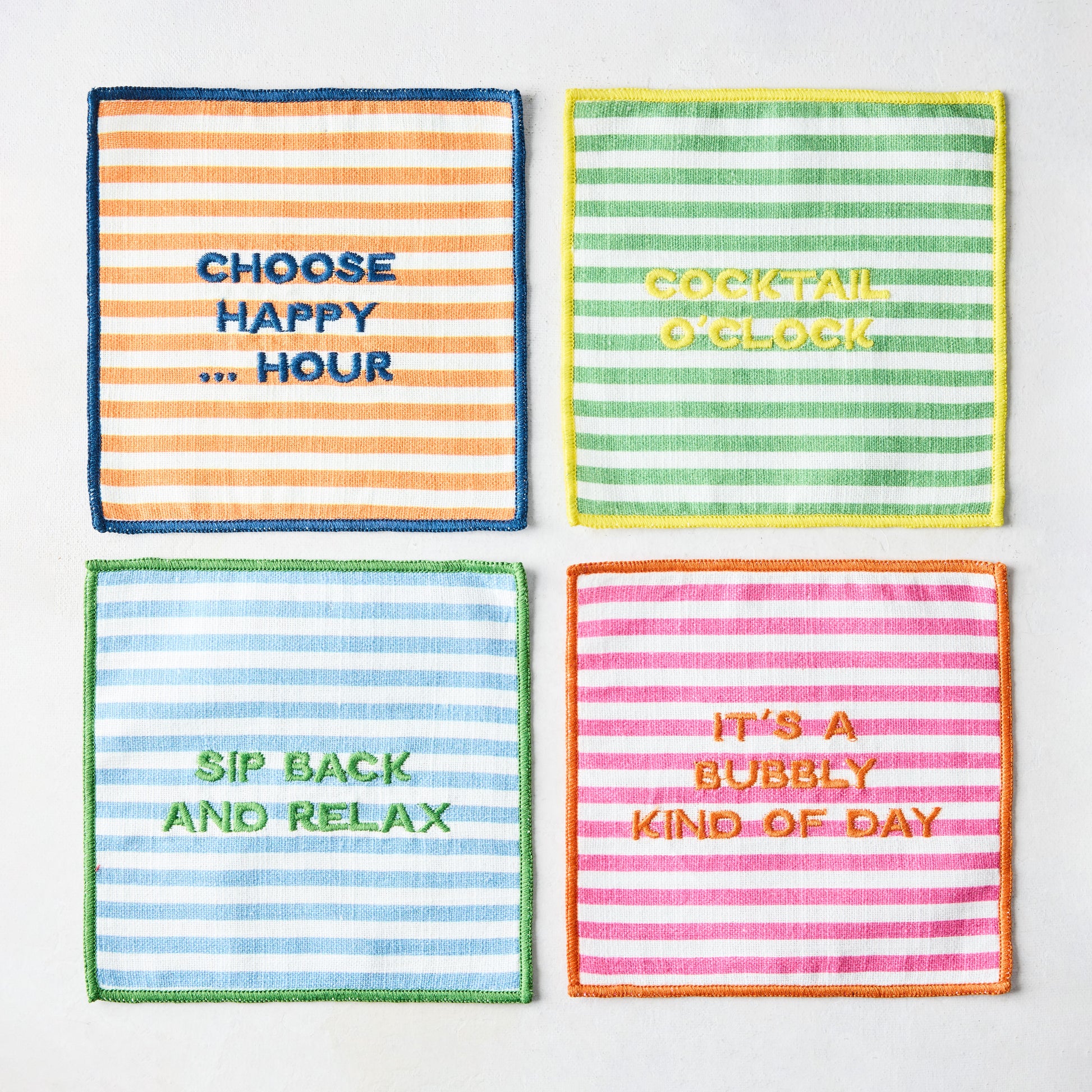 Set of 4 "Happy Hour" stripe embroidered cotton coasters with phrases: Choose Happy Hour, Cocktail O'Clock, Sip Back and Relax, It's a Bubbly Kind of Day.