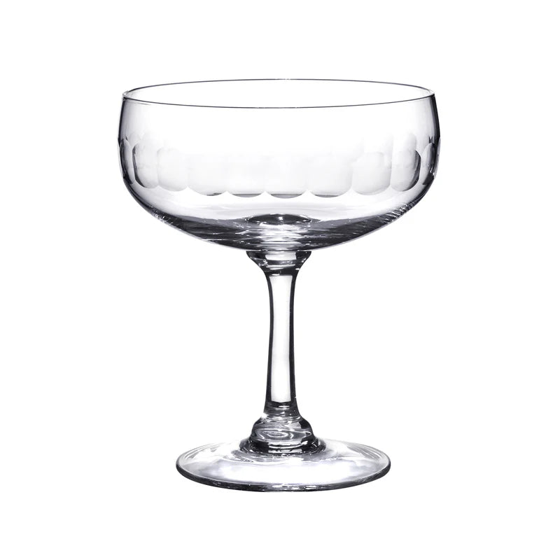 Clear glass Harrington coupe with a wide bowl and etched scalloped pattern on a slender stem and circular base.