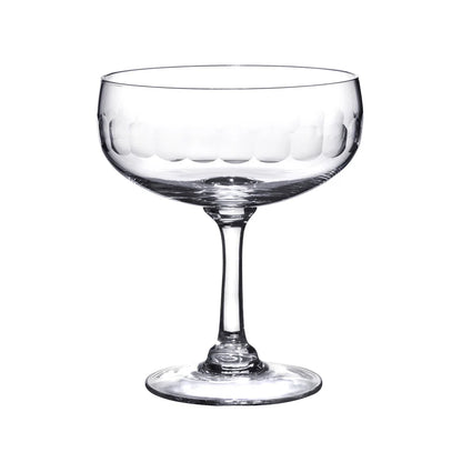 Clear glass Harrington coupe with a wide bowl and etched scalloped pattern on a slender stem and circular base.