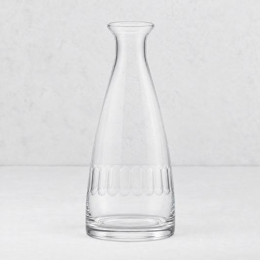 Clear lead-free crystal Harrington carafe with hand-cut oval pattern on a white background.