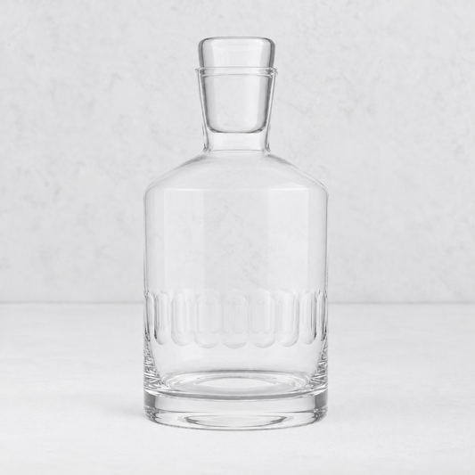 Harrington lead-free crystal decanter with hand-cut oval patterns and a glass stopper on a white background.