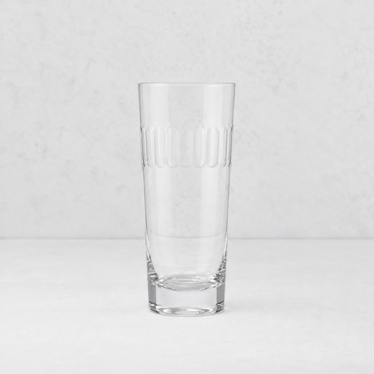 Clear lead-free crystal Harrington highball glass with a hand-cut oval pattern band on a white background.