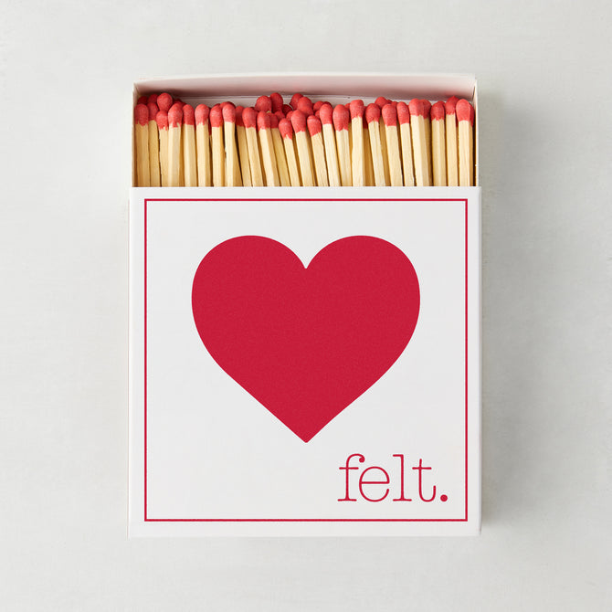 White box of "Heart Felt" oversized matches with a large red heart design and red-tipped matchsticks.