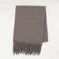 Heather grey cashmere throw blanket with classic fringe.